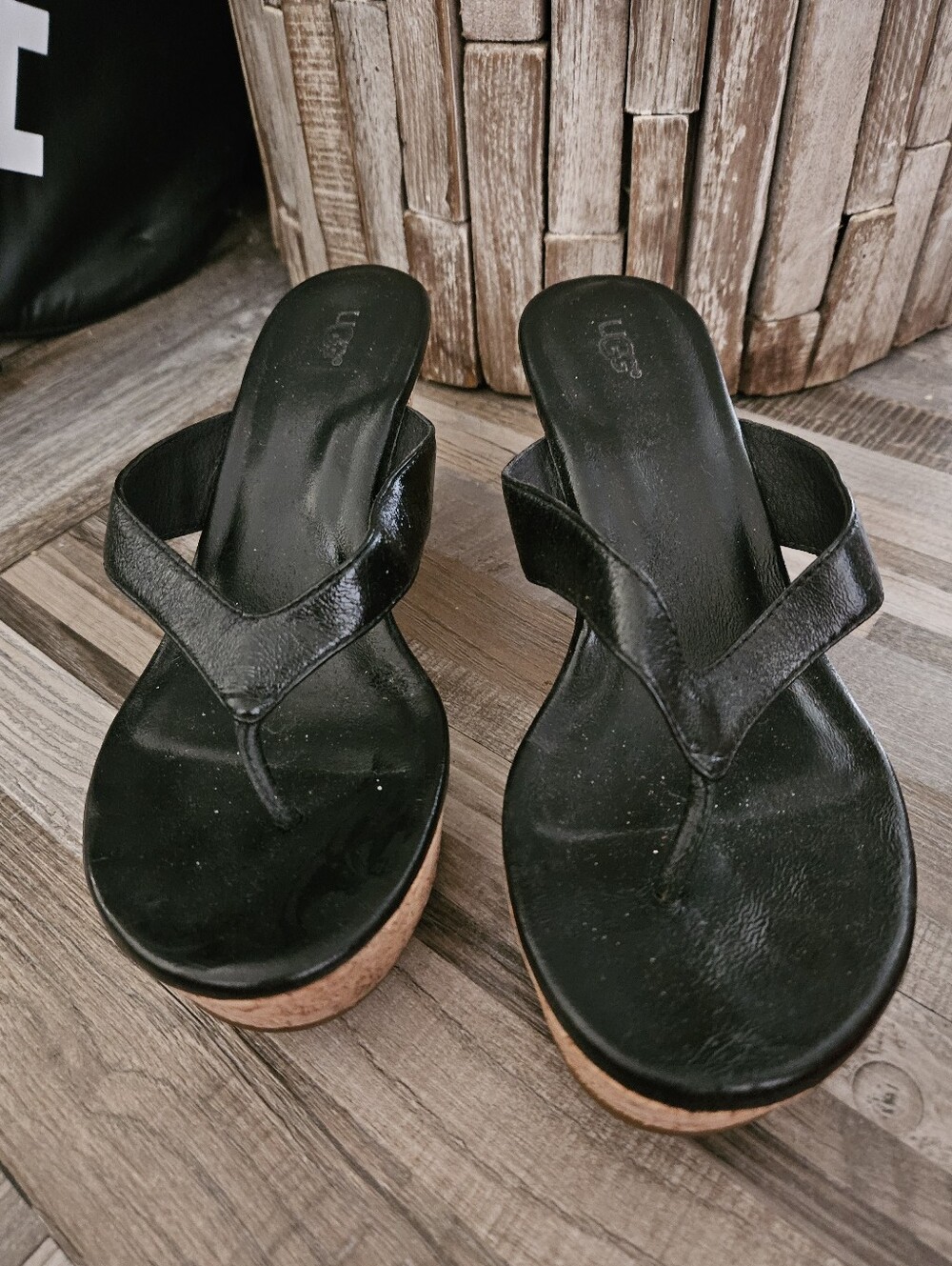 UGG Lucianna black leather and cork wedge thong sandals. 7.5